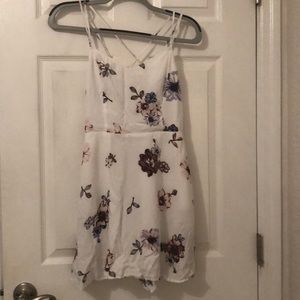 White short dress with multi colored flowers on it